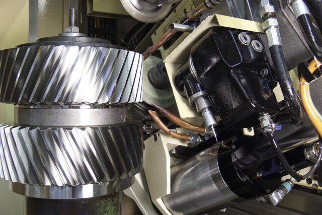 Variable grinding positions for double helical spur gears
